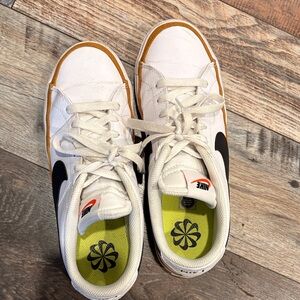 Nike Womens White Sneakers with Black Swoosh and Gold Trim